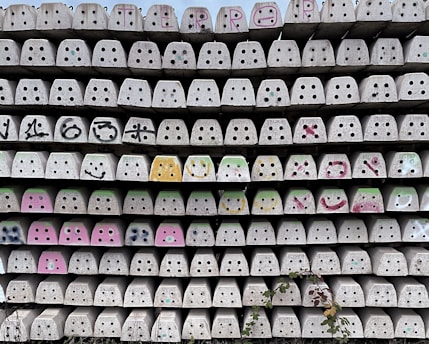Decorative concrete blocks arranged artistically in an outdoor garden wall.