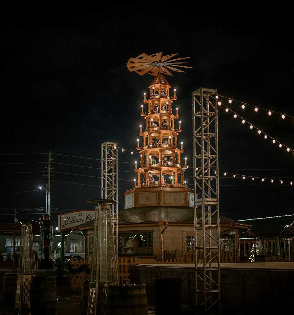 a tall tower with a lot of lights on top of it