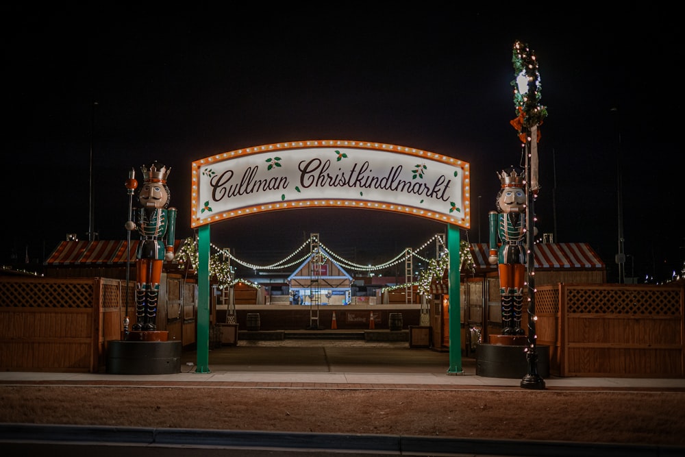 the entrance to the christmas lights festival at night