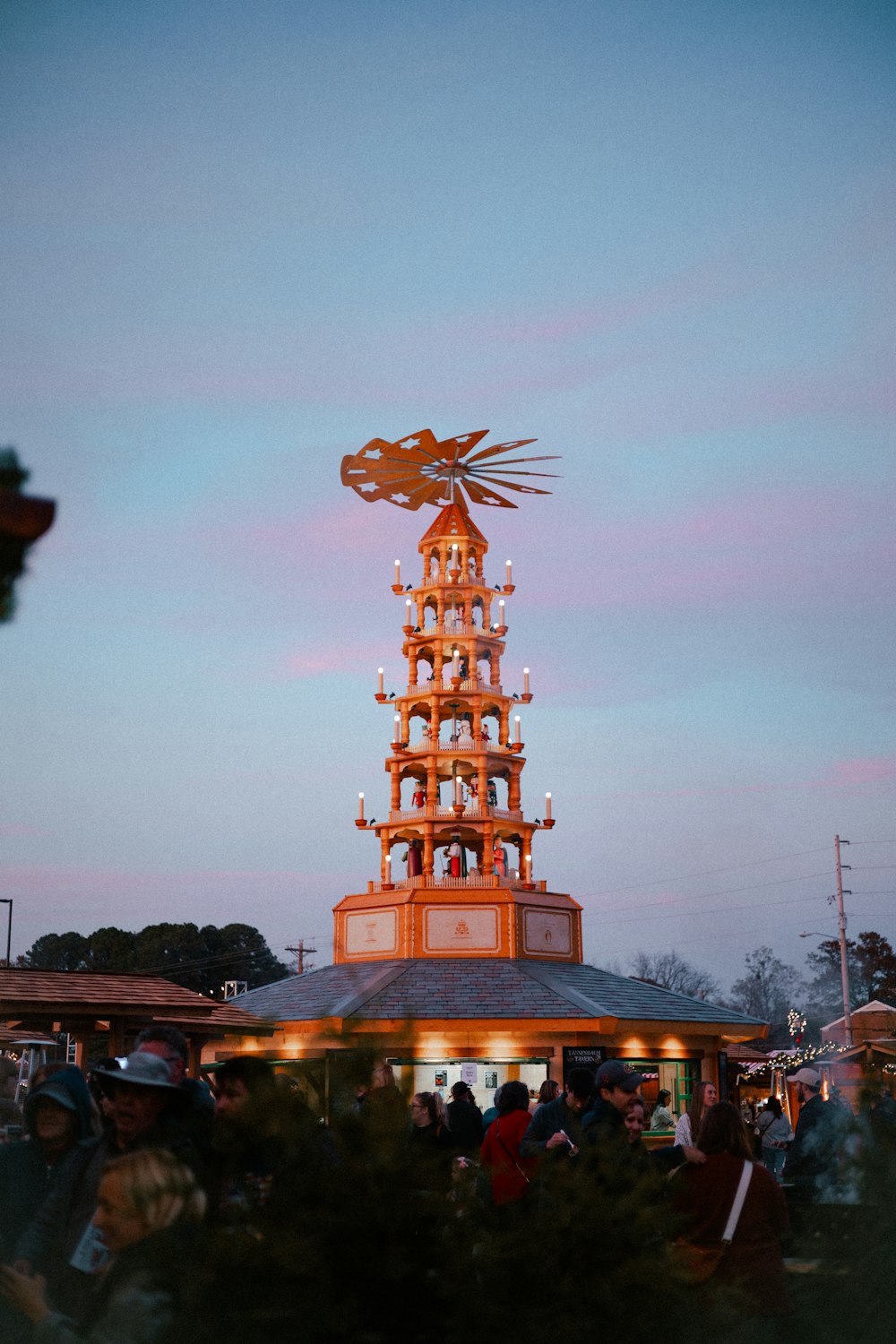 a tall tower with a statue on top of it