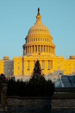 Georgia state capitol building bathed in warm sunlight during a clear day.