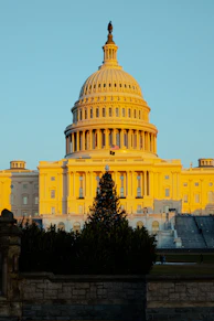Georgia state capitol building bathed in warm sunlight during a clear day.