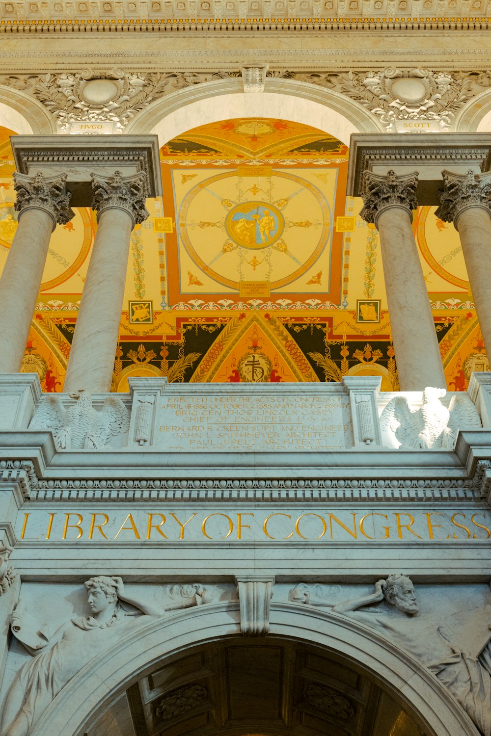 a building with columns and a clock above it