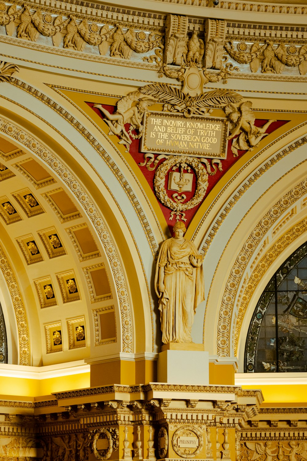 a large ornate building with a clock on the wall