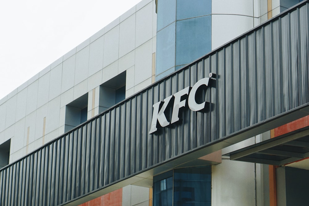 a building with a kfc sign on the side of it