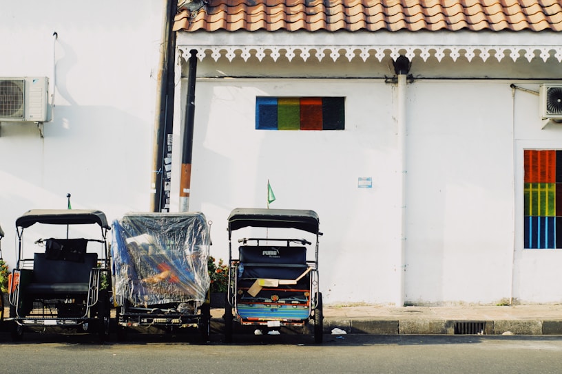 a couple of carts sitting next to a building