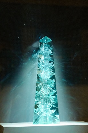 An ethereal sculpture of floating marble and glass illuminated by divine light