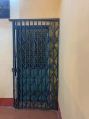 Team of qualified staff installing a heavy-duty security door.