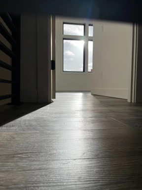 A welcoming home entrance bathed in natural light, symbolizing cleanliness and comfort.