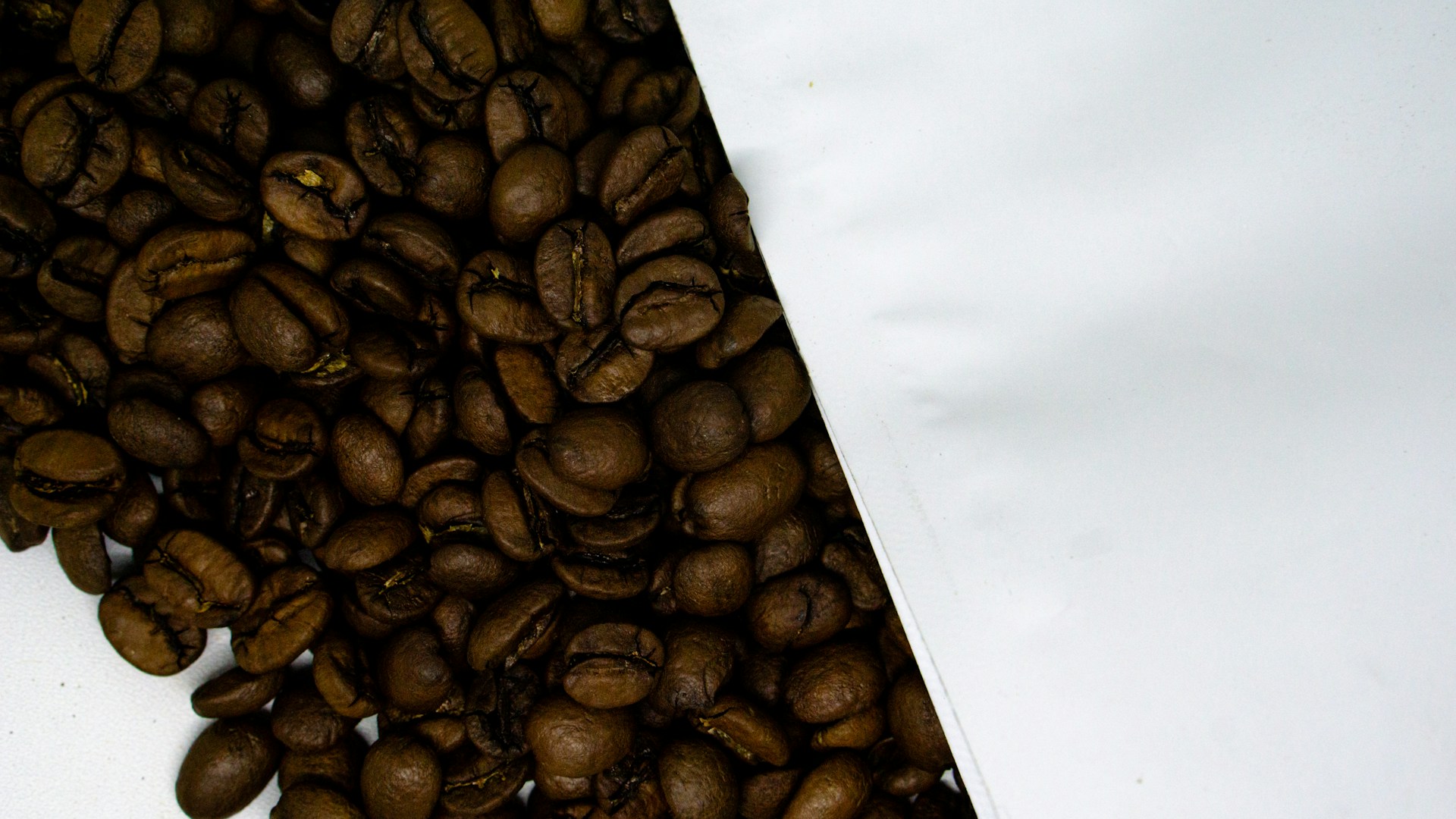 a pile of coffee beans sitting on top of a table
