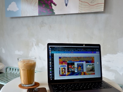A modern workspace setup with a laptop and coffee.