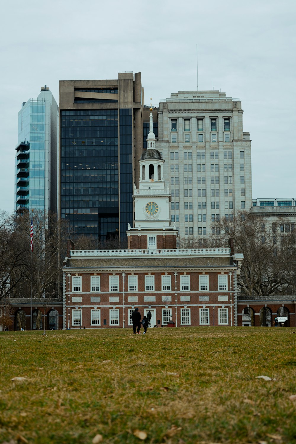 a couple of people standing in front of a building