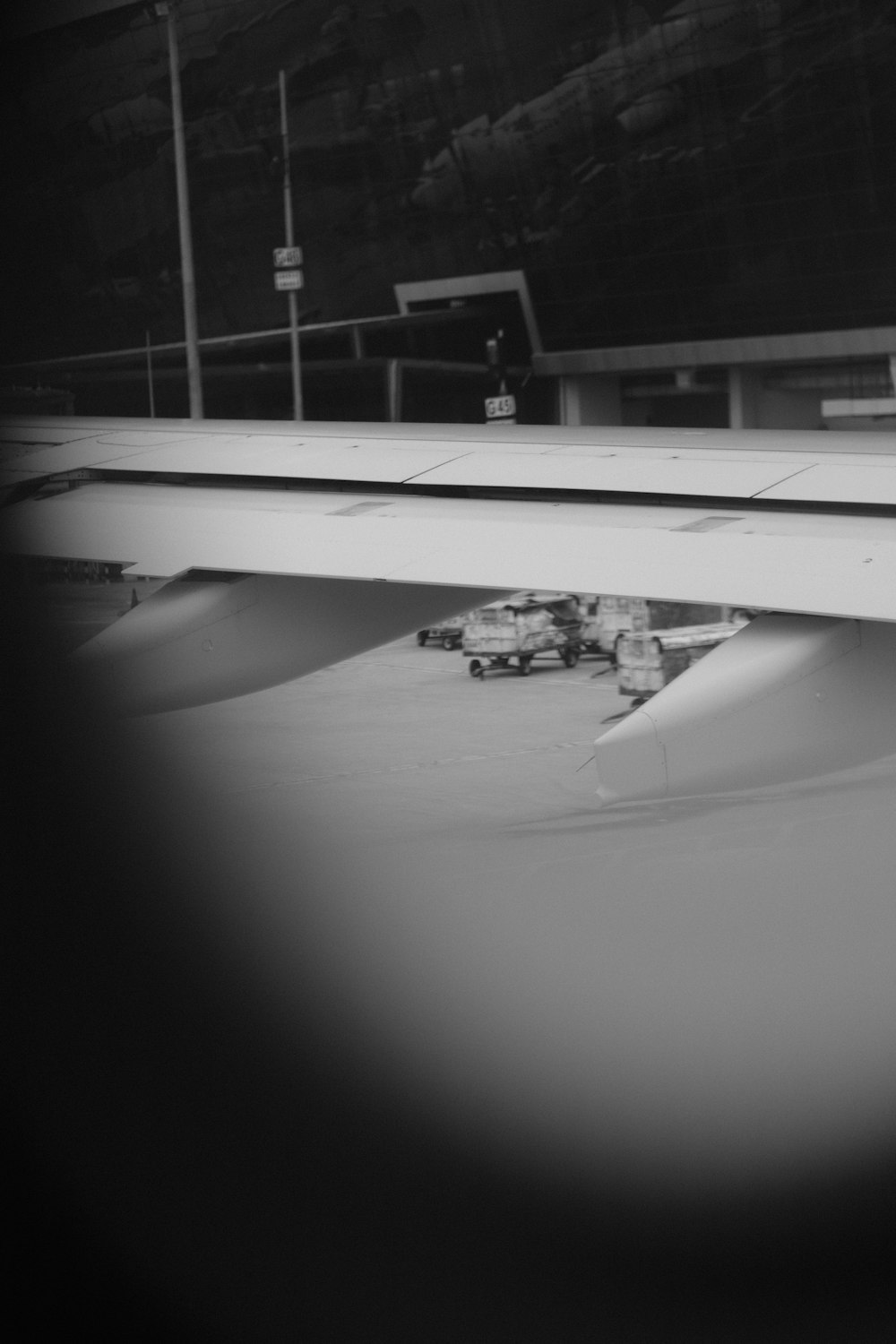 a black and white photo of an airplane wing