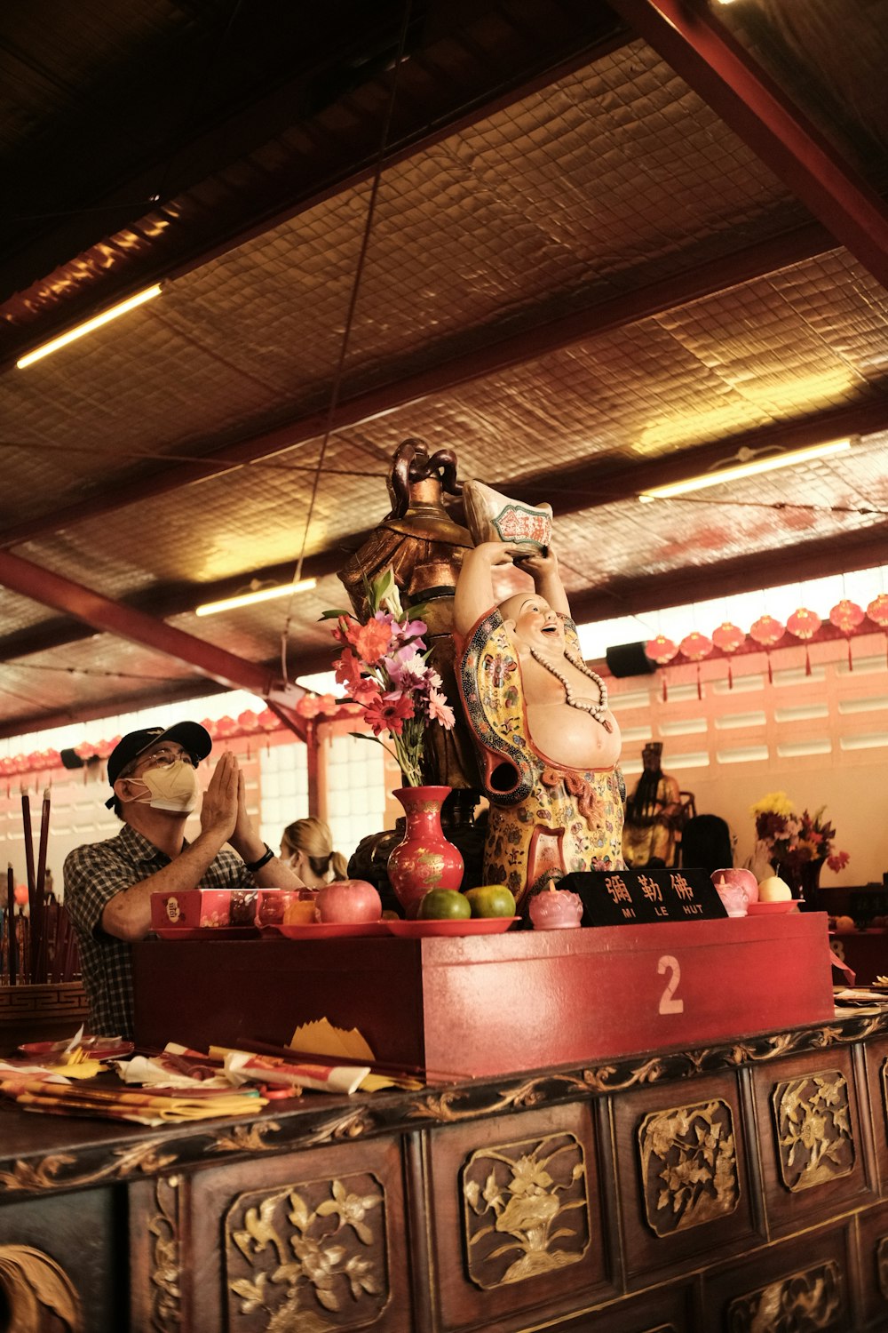 a statue of a woman sitting on top of a table