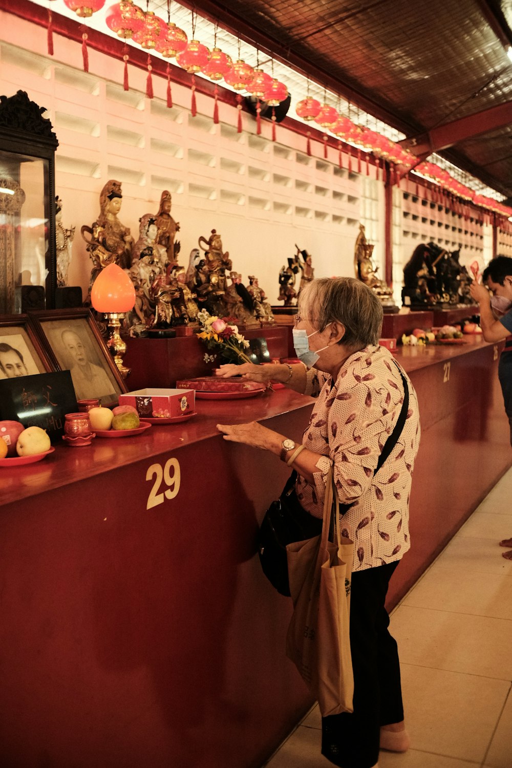 a woman standing at a counter in a store