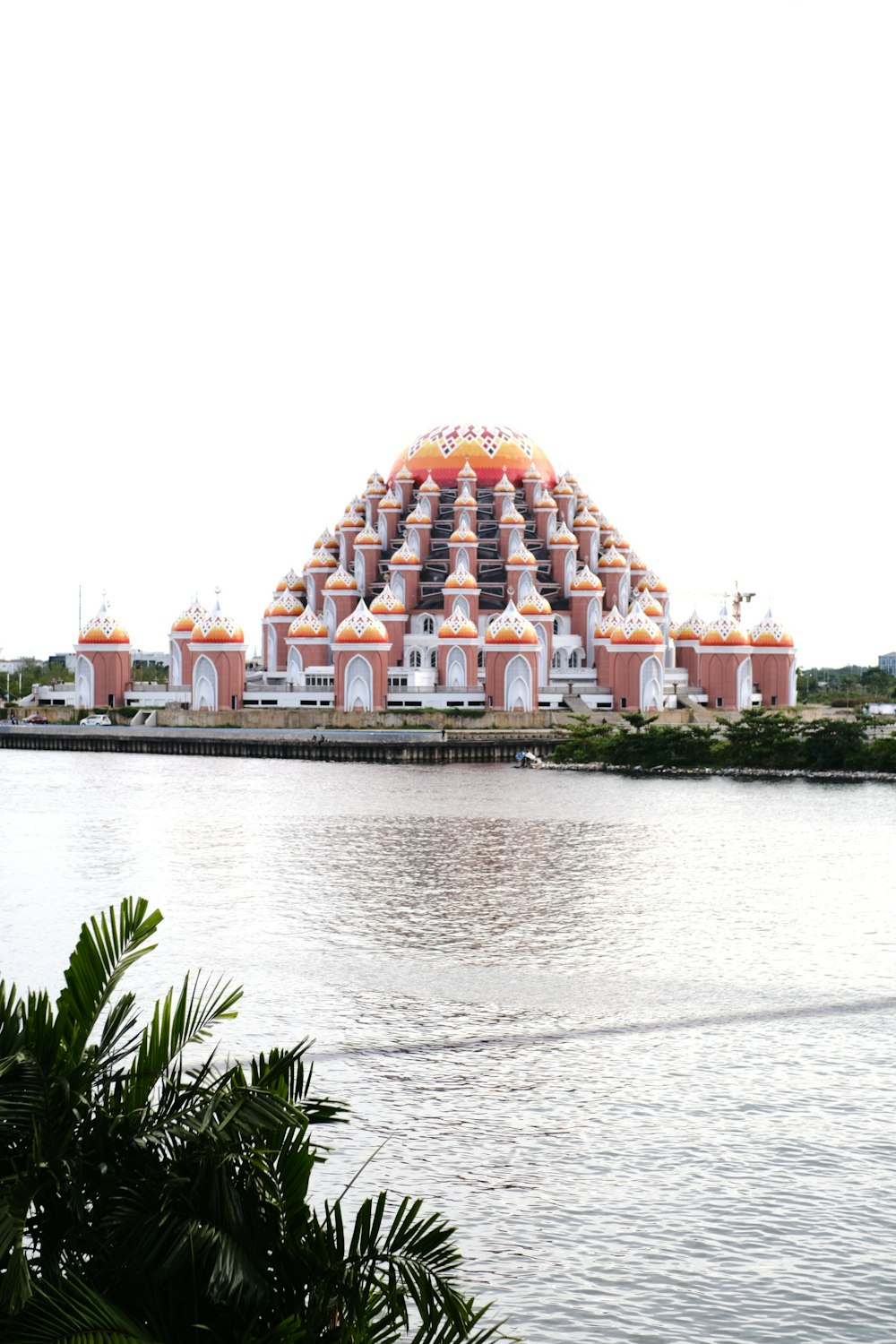 a large building sitting on top of a body of water