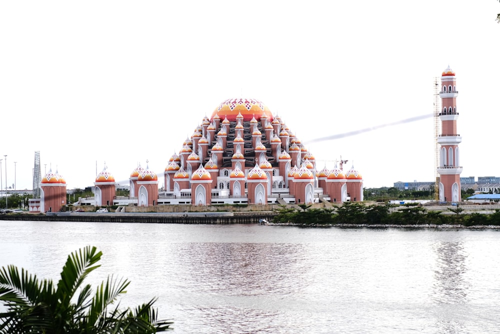 a large building sitting next to a body of water