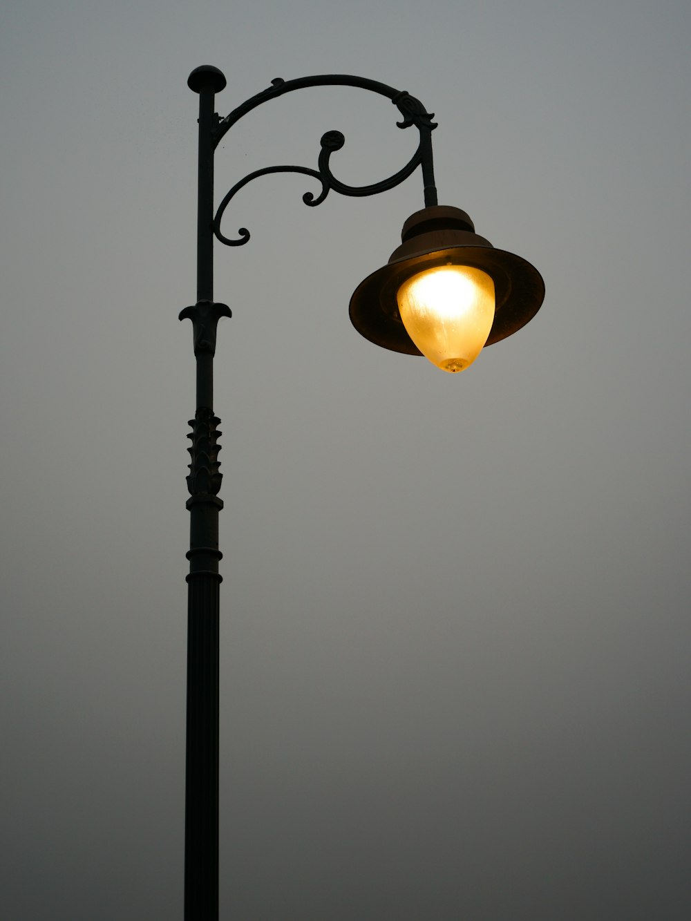 a lamp post with a light on top of it