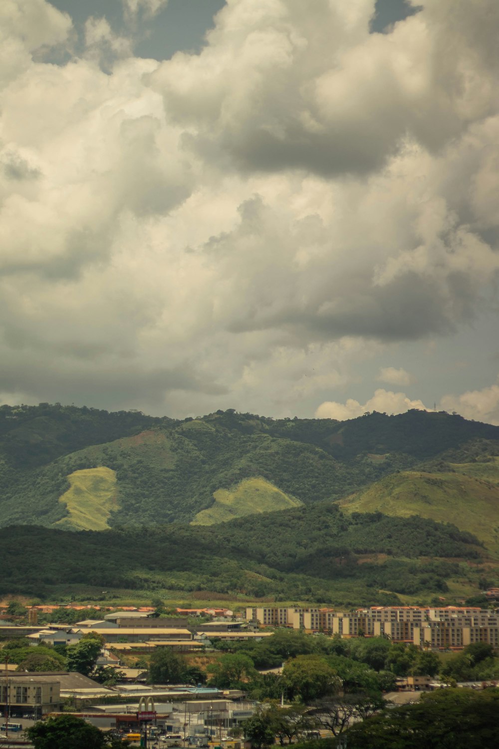 a view of a city with mountains in the background