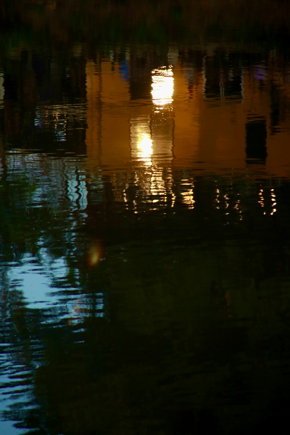 the reflection of a building in the water