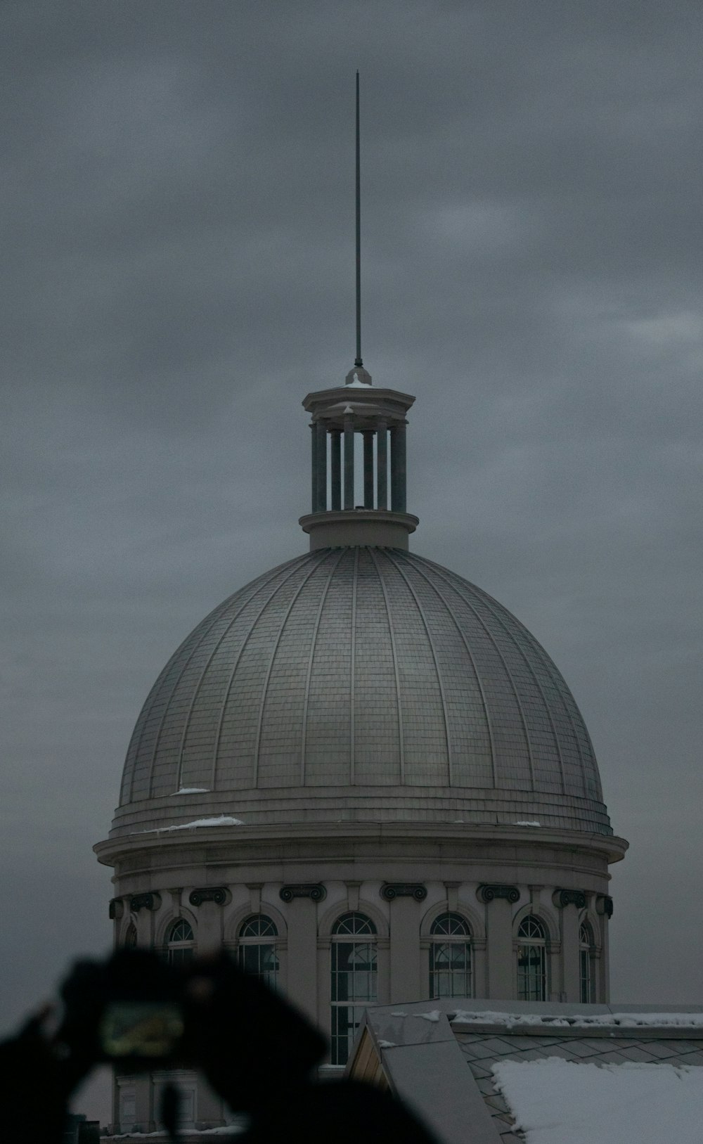 a dome with a weather vane on top of it