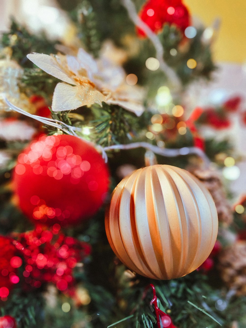 a close up of a christmas tree with ornaments