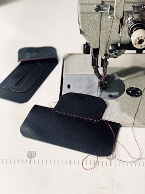 Interlock sewing machine with fabric sample ready for stitching.