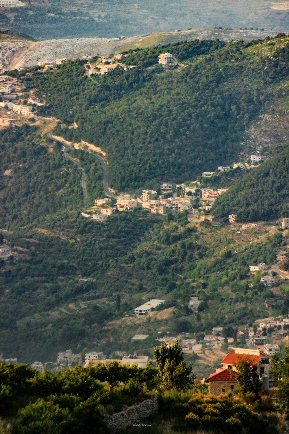 a view of a town nestled on a mountain
