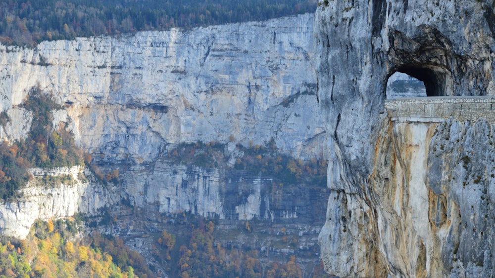 a view of a cliff with a hole in the middle