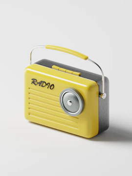 a yellow radio sitting on top of a white table