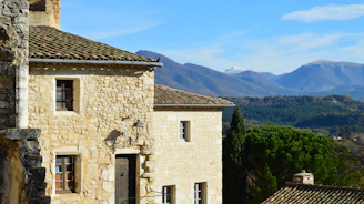 Stone walls and wooden beams of a restored rural house nestled in the Sierra Nevada mountains.