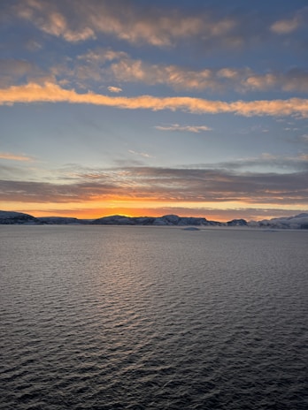 A panoramic view of the Dead Sea’s tranquil waters reflecting the early morning light.