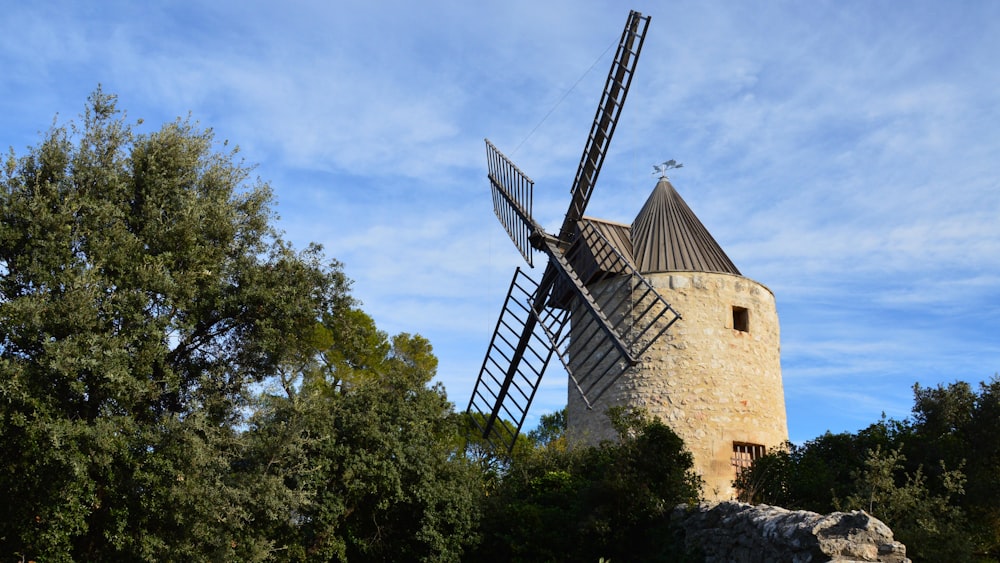 a windmill is shown in the middle of a field