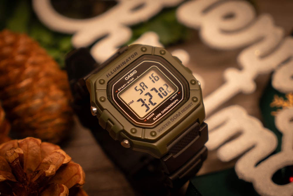 a close up of a watch on a table