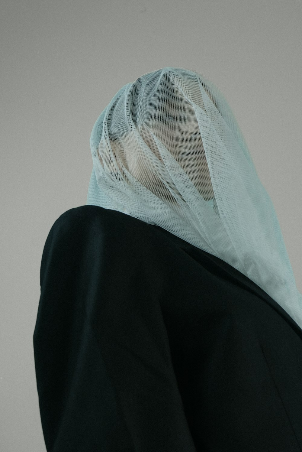a woman with a veil on her head