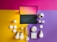 A flat lay composition featuring a tablet with a keyboard, a smartphone, smart bulbs, a camera, and various small smart devices arranged against a colorful geometric background. The background consists of vibrant magenta, yellow, and purple sections.