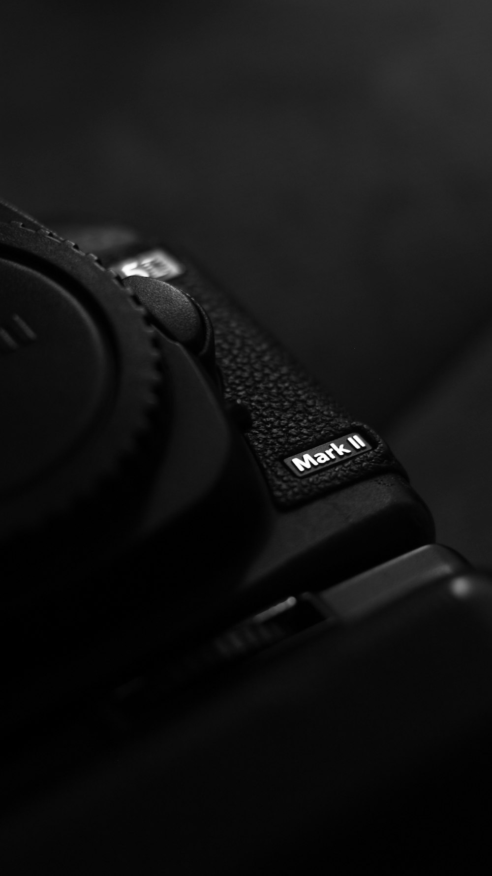 a close up of a camera with a black background