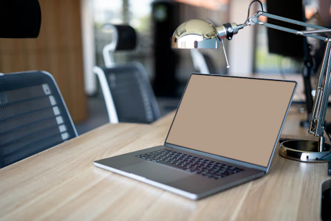 Open laptop on a desk in a quiet workspace.