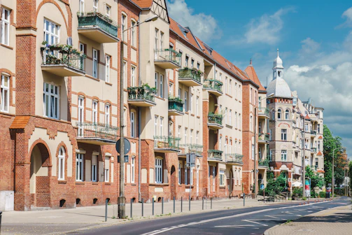 a row of brick buildings on a city street
