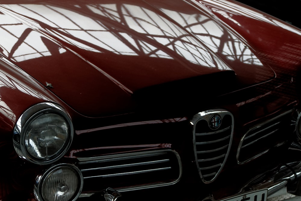 a close up of the front of a classic car