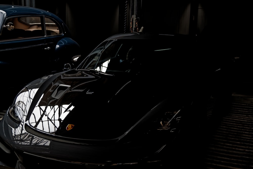 a black sports car parked in a garage