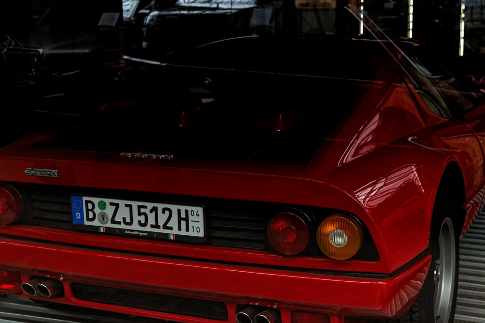 a red sports car parked in a garage