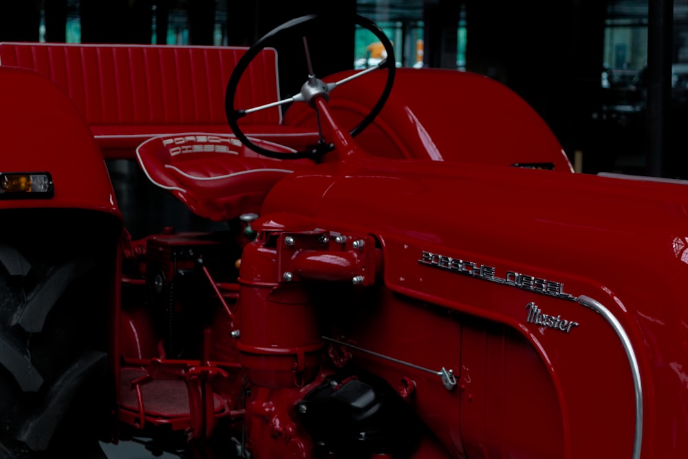 a close up of the front of a red tractor