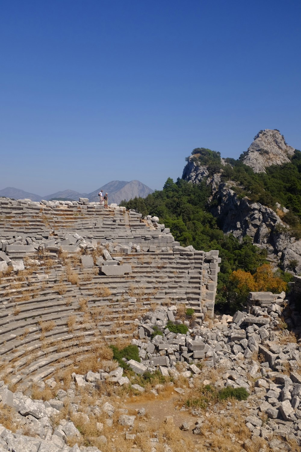 a large stone structure sitting on top of a hill