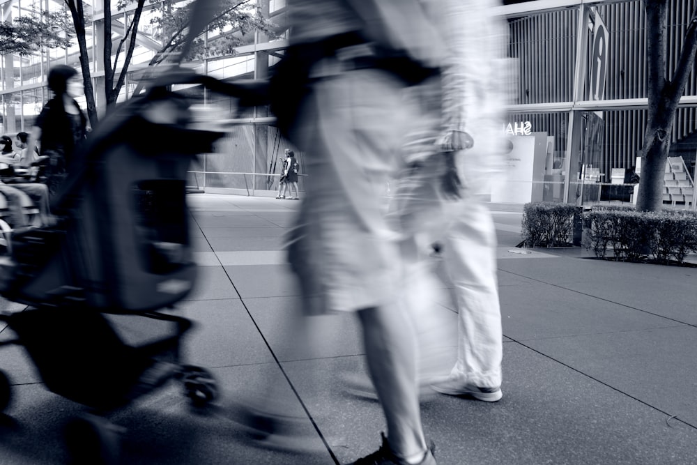 a blurry photo of a person pushing a stroller