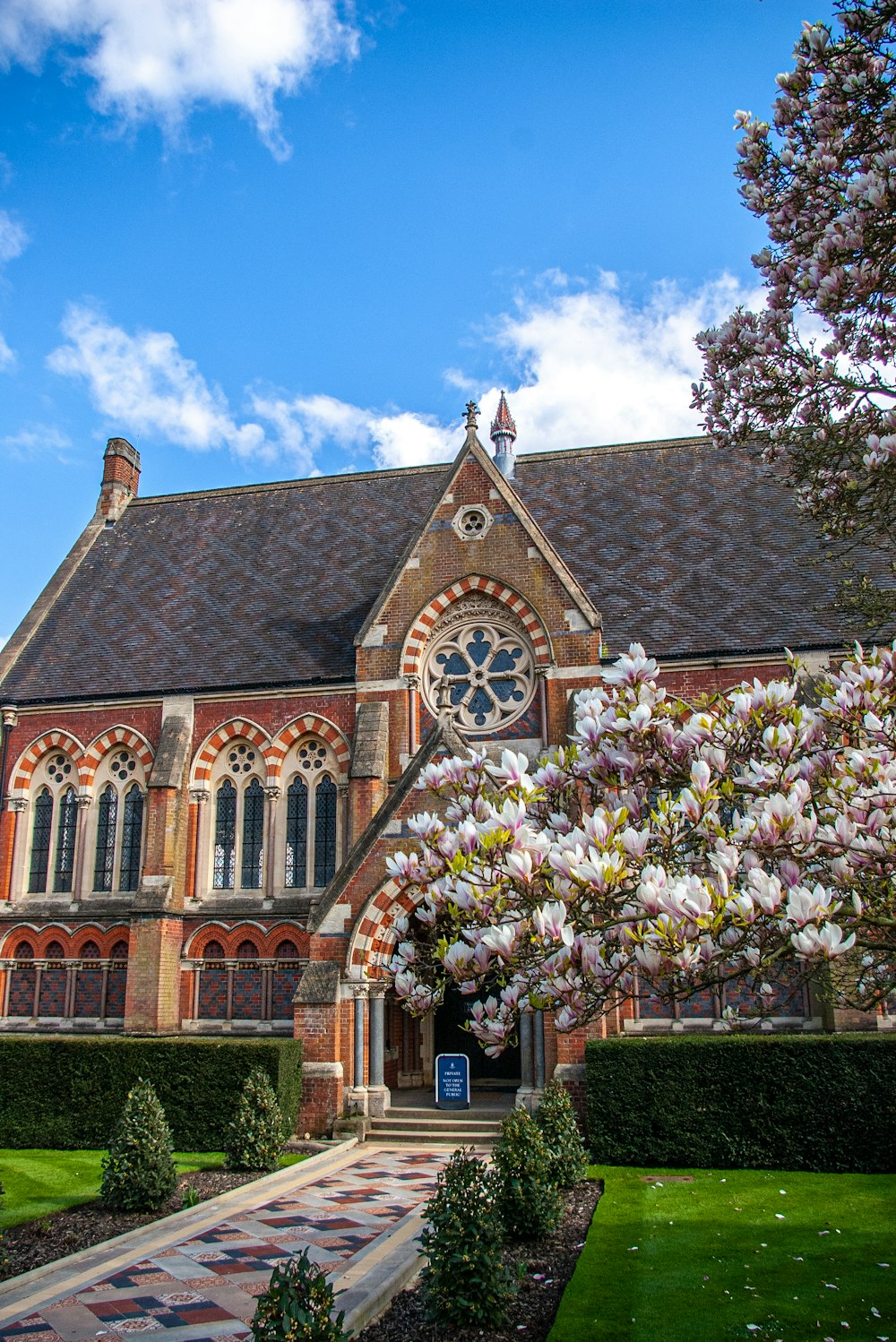 a large building with a tree in front of it