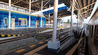 A modern railway station with trains and infrastructure.