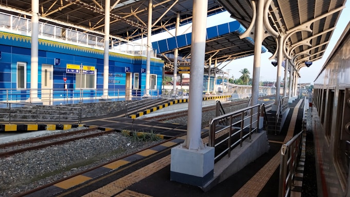 A modern railway station with trains and infrastructure.