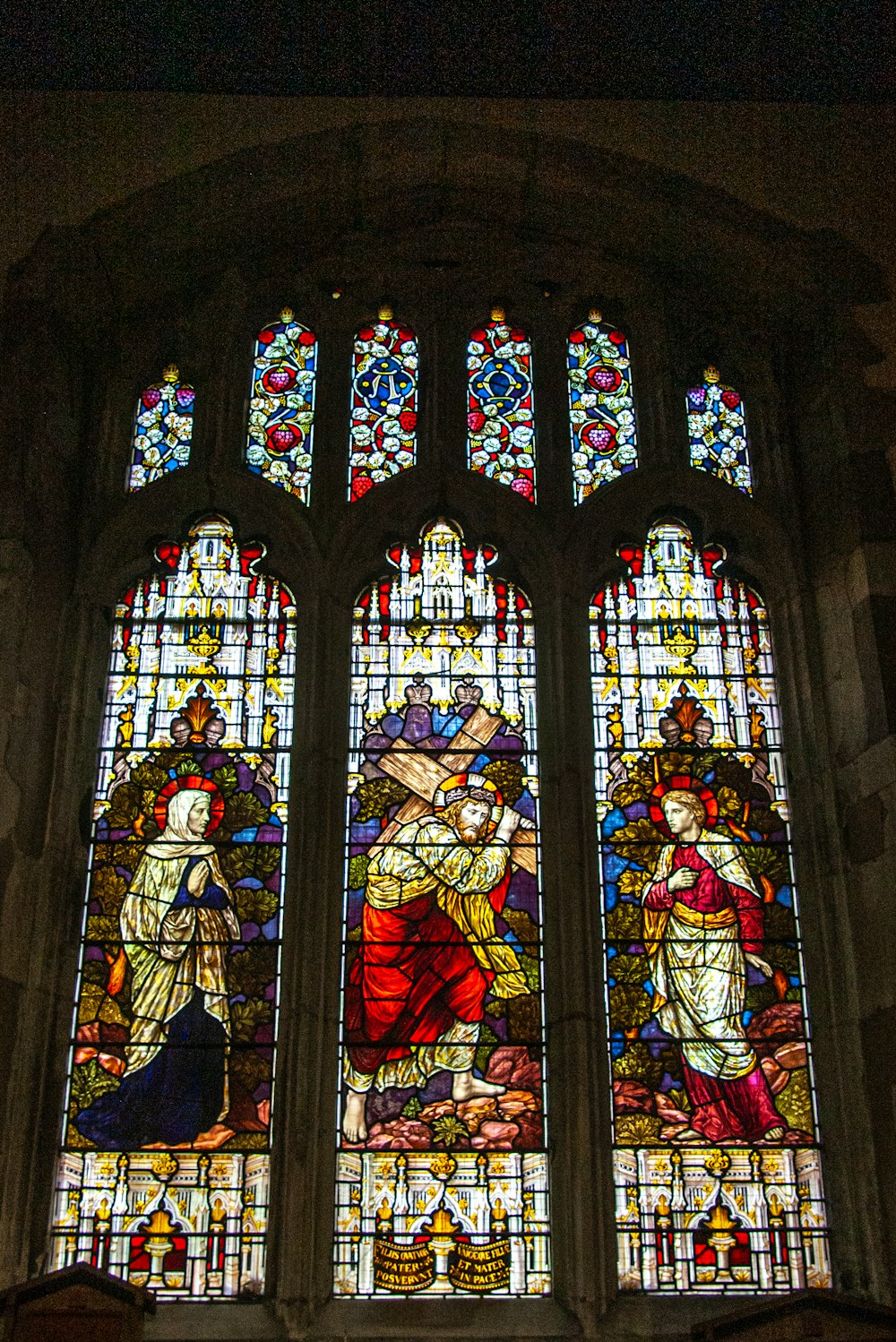 a large stained glass window in a church