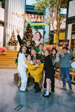 A festive gathering in an assisted living facility with live music and decorations.